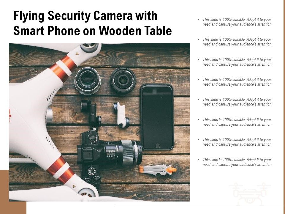 Flying_Security_Camera_With_Smart_Phone_On_Wooden_Table_Ppt_PowerPoint_Presentation_File_Topics_PDF_Slide_1.jpg