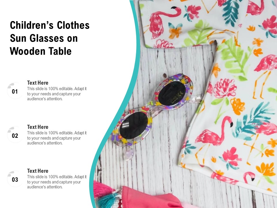 Childrens Clothes Sun Glasses On Wooden Table Ppt PowerPoint Presentation Pictures Rules PDF