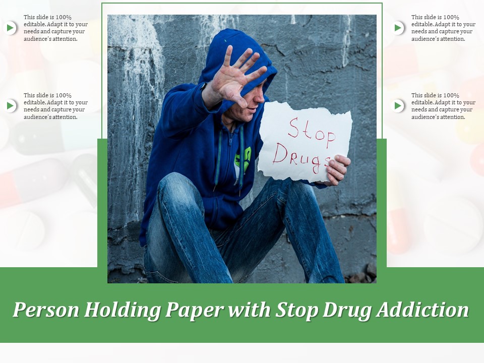 Person Holding Paper With Stop Drug Addiction Ppt PowerPoint Presentation Gallery Model PDF