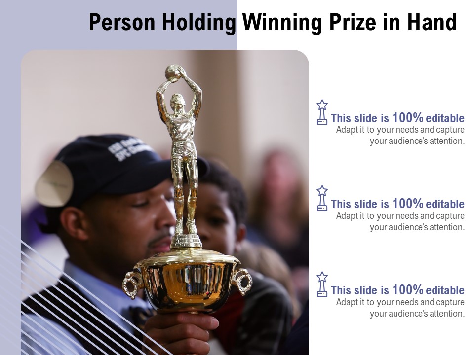 Person Holding Winning Prize In Hand Ppt PowerPoint Presentation File Background PDF